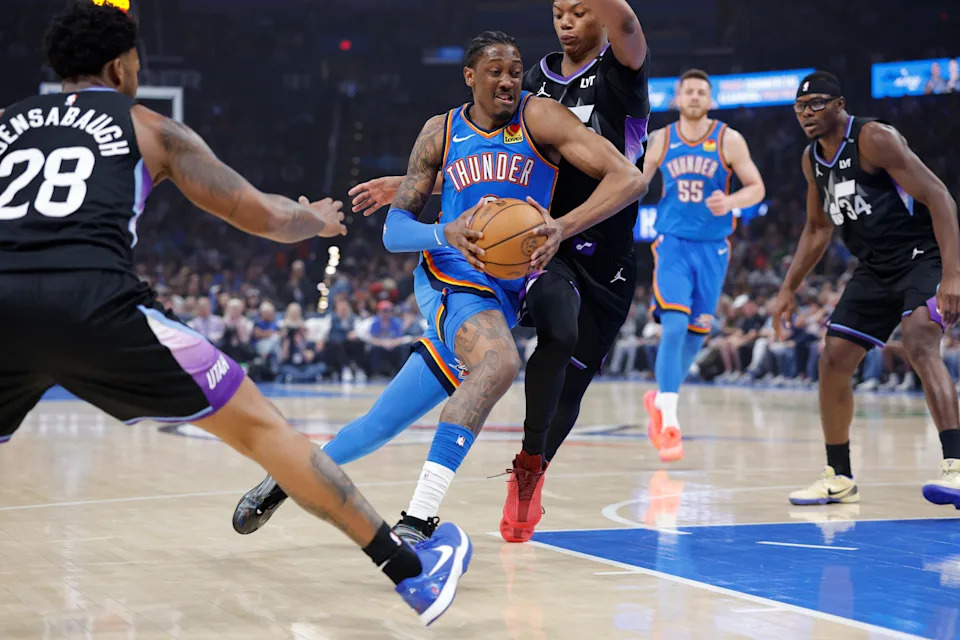 Apr 5, 2026; Oklahoma City, Oklahoma, USA; Oklahoma City Thunder guard Jalen Williams (8) drives between Utah Jazz forward Brice Sensabaugh (28) and guard Ace Bailey (19) during the first quarter at Paycom Center. Mandatory Credit: Alonzo Adams-Imagn Images