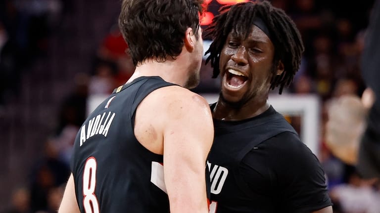 Portland Trail Blazers forward Deni Avdija (8) is greeted by...