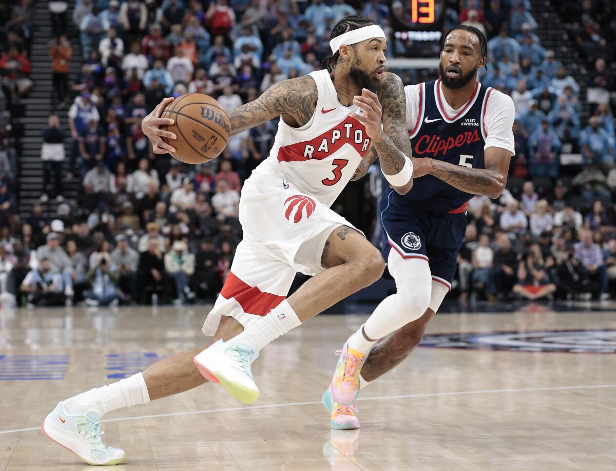 Portland’s Brandon Ingram, left, controls the ball in front of the Clippers’ Derrick Jones Jr. 