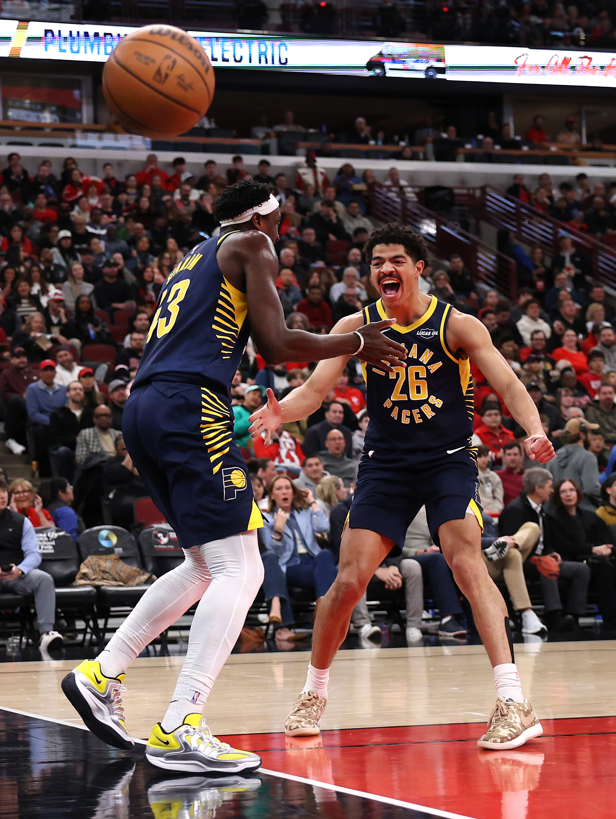 Indiana Pacers guard Ben Sheppard (26) celebrates with teammate Pascal Siakam after Sheppard passed to Siakam for a dunk in the first half of a game against the Chicago Bulls at the United Center in Chicago on April 1, 2026. (Chris Sweda/Chicago Tribune)