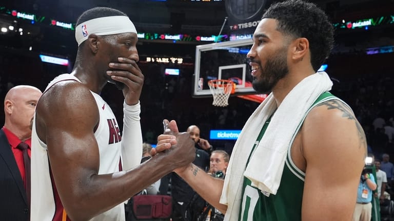 Miami Heat center Bam Adebayo, left, and Boston Celtics forward...
