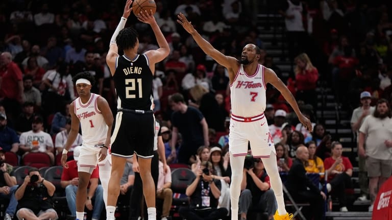 Milwaukee Bucks forward Ousmane Dieng (21) shoots against Houston Rockets...