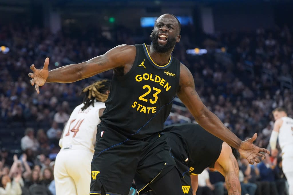 Golden State Warriors forward Draymond Green gestures toward an official during the first half. AP