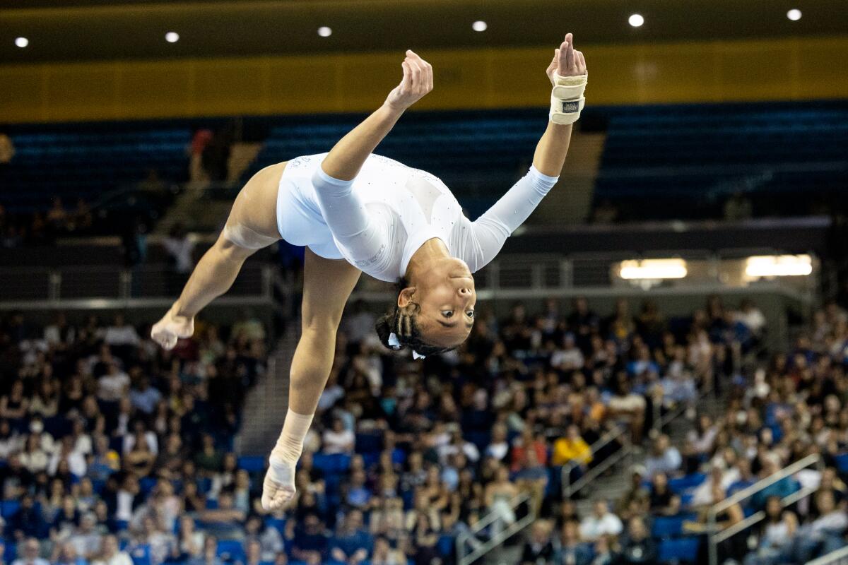 UCLA gymnast Mika Webster-Longin competes on the balance beam during the Big Four Gymnastics competition.