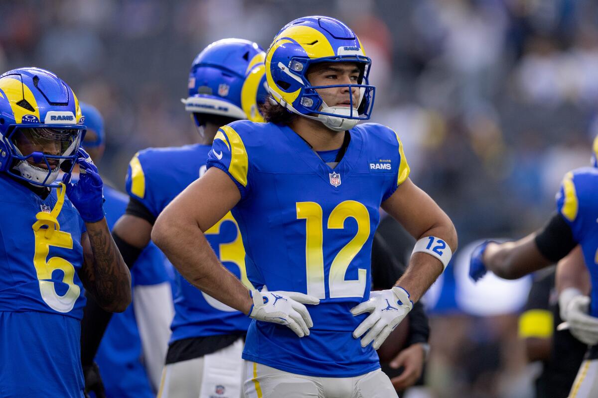 Puka Nacua stands on the field during a win over the Detroit Lions at SoFi Stadium in December.