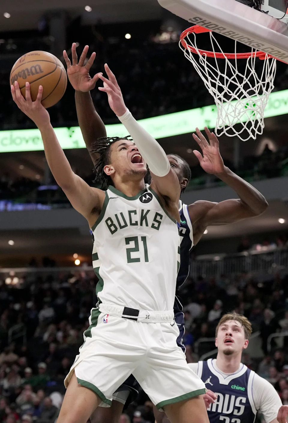 Milwaukee Bucks forward Ousmane Dieng (21) scores on Dallas Mavericks center Moussa Cisse (30) during the second half of their game Tuesday, March 31, 2026 at Fiserv Forum in Milwaukee, Wisconsin. The Milwaukee Bucks beat the Dallas Mavericks 123-99.