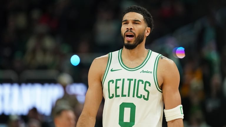 Boston Celtics' Jayson Tatum looks on before an NBA basketball...