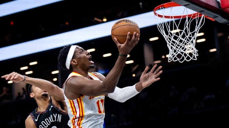 Atlanta Hawks forward Onyeka Okongwu (17) scores during the first...