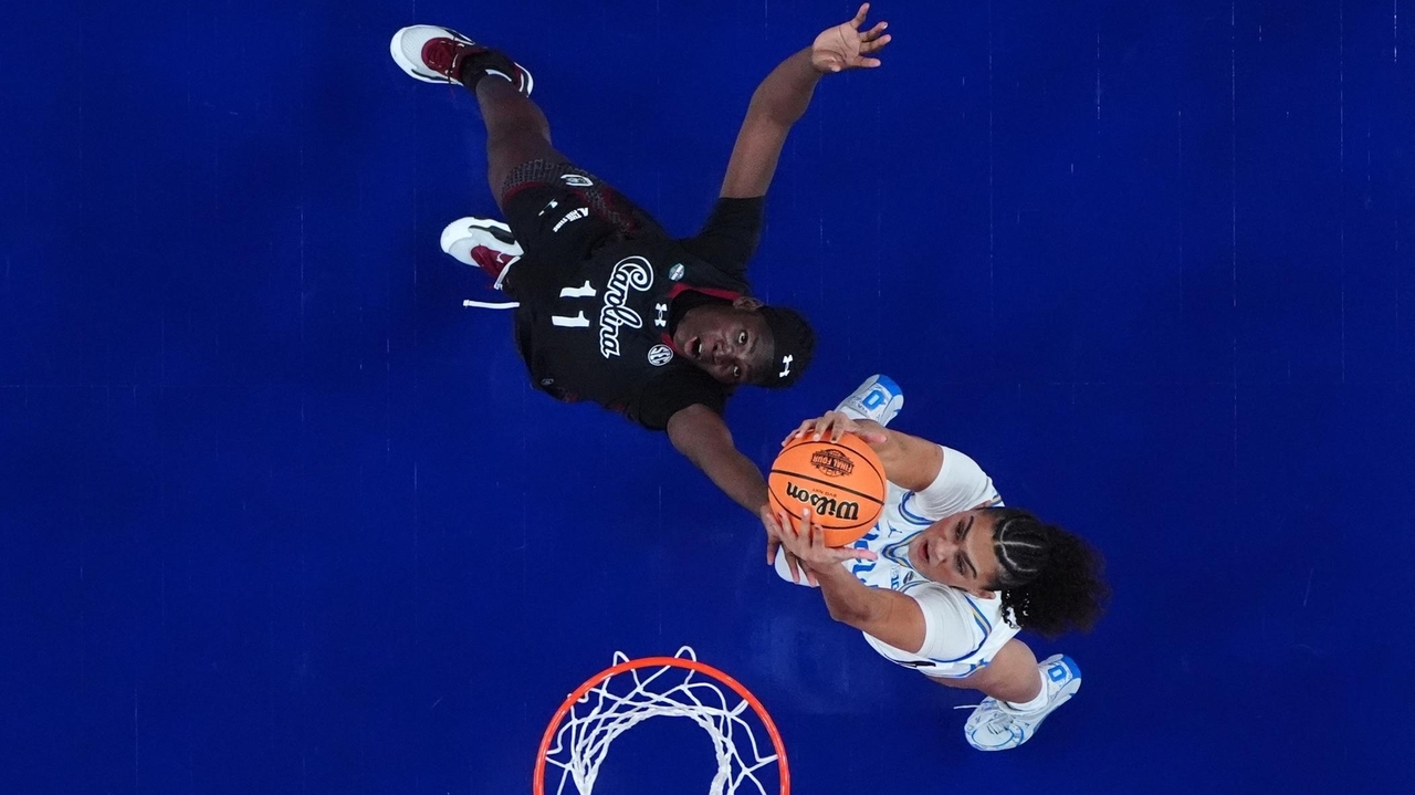 Staley embraces UCLA's Close ahead of title game, then smirks to the crowd after handshake drama