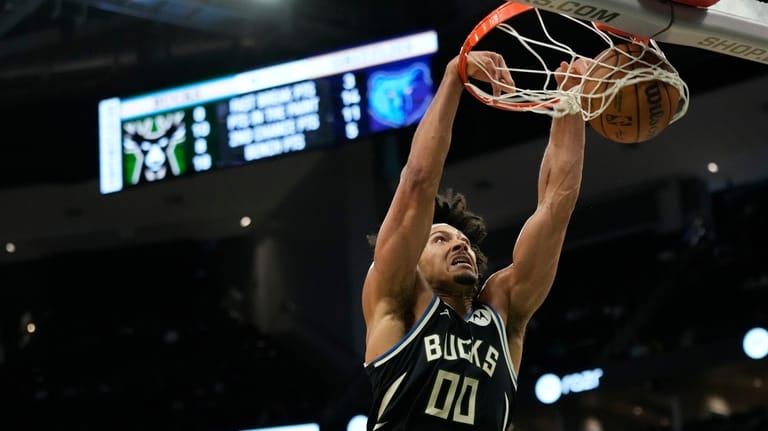 Milwaukee Bucks' Jericho Sims dunks during the first half of...