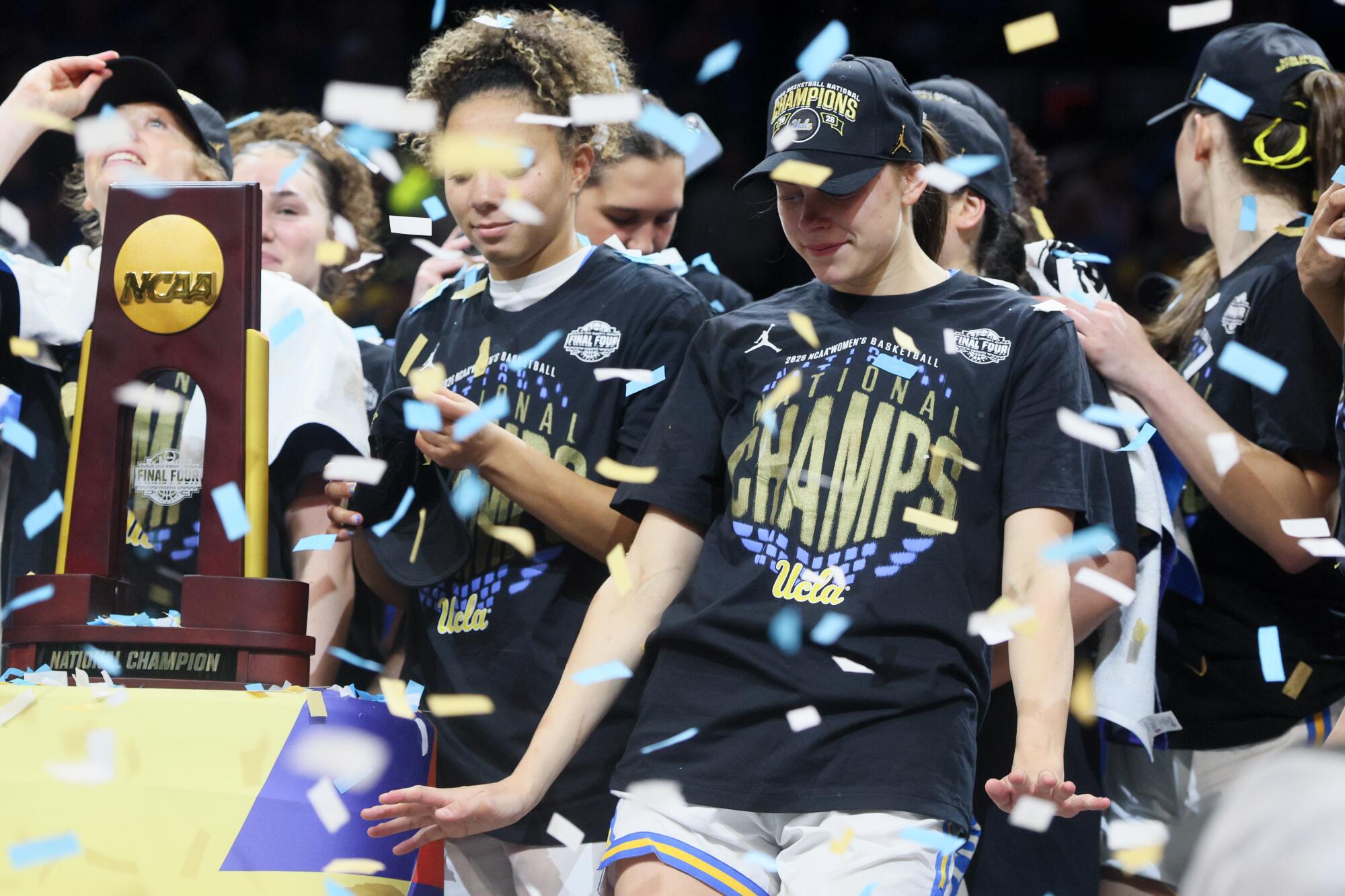 UCLA players, including Kiki Rice, left, and Gabriela Jaquez celebrate winning the NCAA title.
