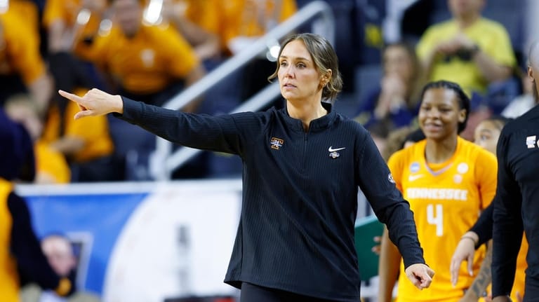 Tennessee coach Kim Caldwell gives instructions against North Carolina State...