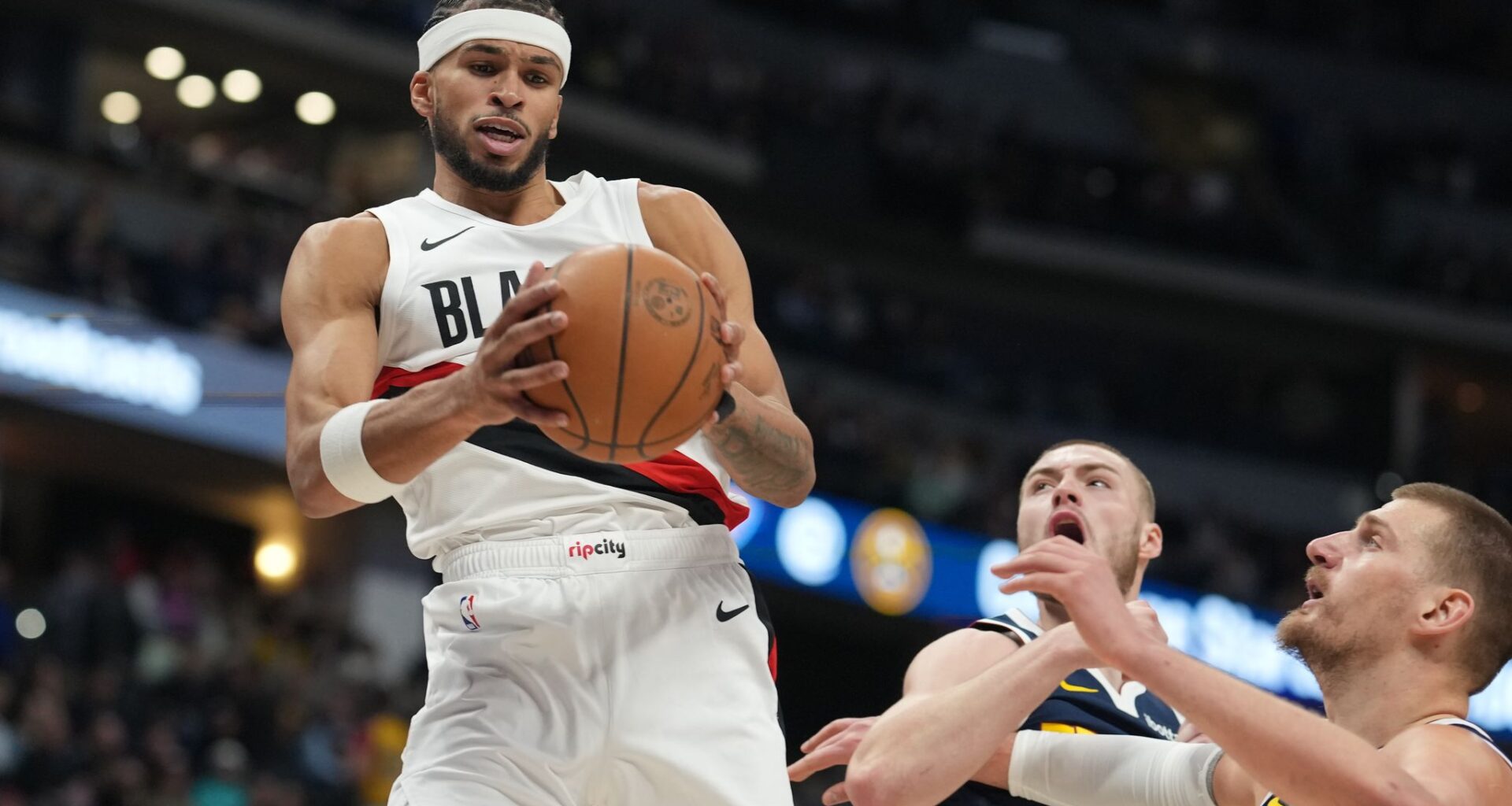 Jokic's 35 points, 13 rebounds, 13 assists help the Nuggets get past the Trail Blazers 137-132 in OT