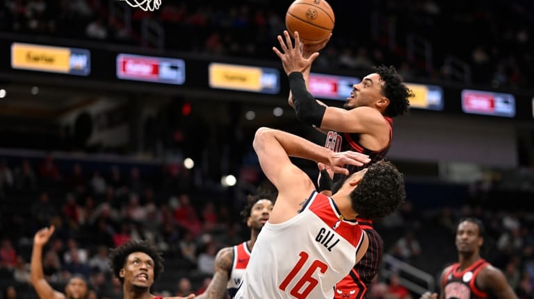 Chicago Bulls guard Tre Jones goes to shoot against Washington...