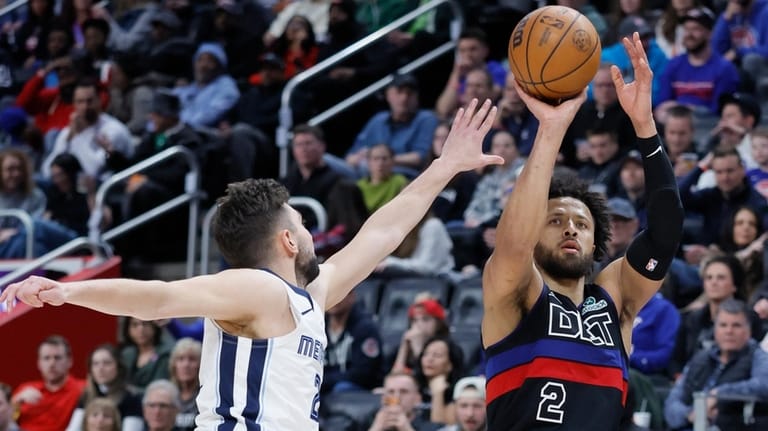 Detroit Pistons guard Cade Cunningham (2) takes a jump shot...
