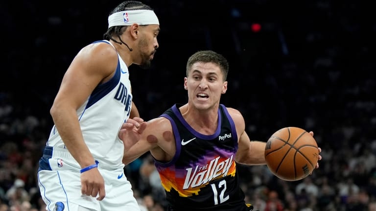 Phoenix Suns guard Collin Gillespie (12) dribbles the ball against...