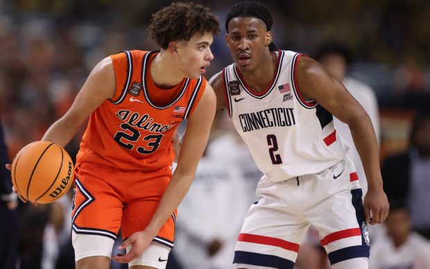 Illinois guard Keaton Wagler (23) works against UConn guard Silas Demary Jr. in the first half during the Final Four on April 4, 2026, at Lucas Oil Stadium in Indianapolis. (Armando L. Sanchez/Chicago Tribune)