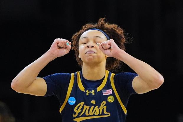 Notre Dame guard Hannah Hidalgo celebrates late in the second half in the Sweet 16 of the NCAA college basketball tournament against Vanderbilt, Friday, March 27, 2026, in Fort Worth, Texas. (AP Photo/LM Otero)