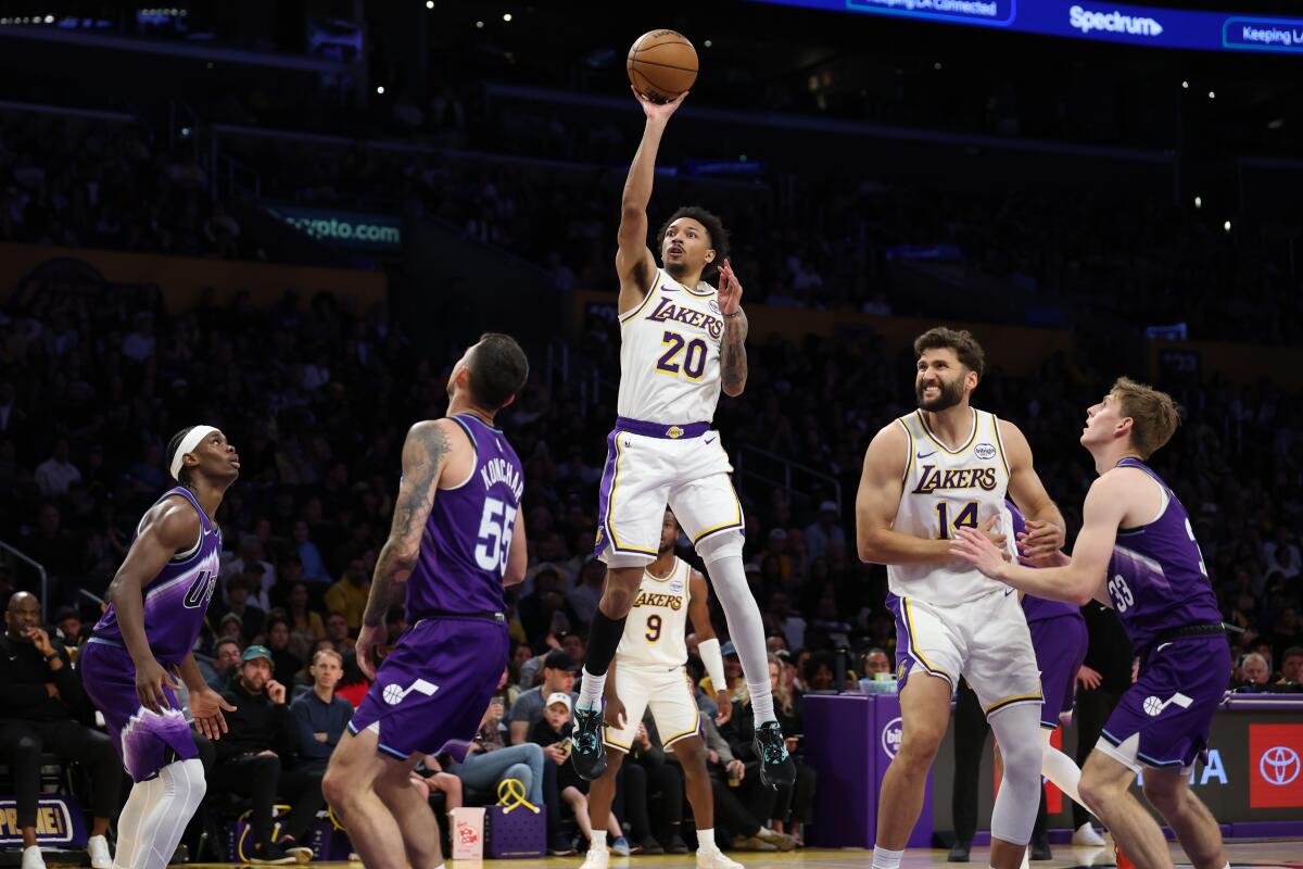 Lakers guard Nick Smith Jr. drives to the basket against the Utah Jazz on Sunday.