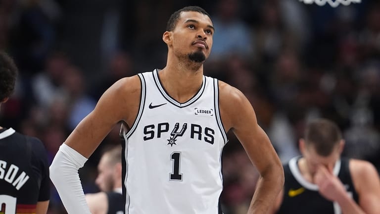 San Antonio Spurs center Victor Wembanyama reacts after being called...