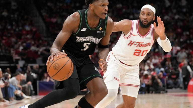 Minnesota Timberwolves guard Anthony Edwards (5) controls the ball against...