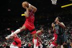 Raptors forward Scottie Barnes, left, grabs the rebound in front of Brooklyn Nets' Chaney Johnson on Sunday. Frank Gunn/The Canadian Press