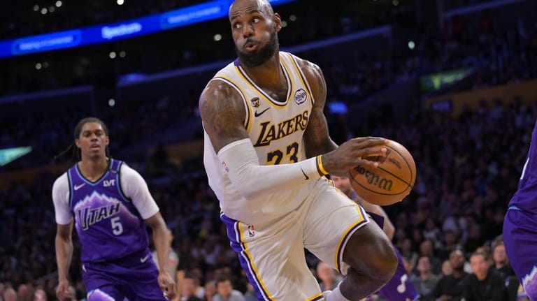 Los Angeles Lakers forward LeBron James looks to make a...