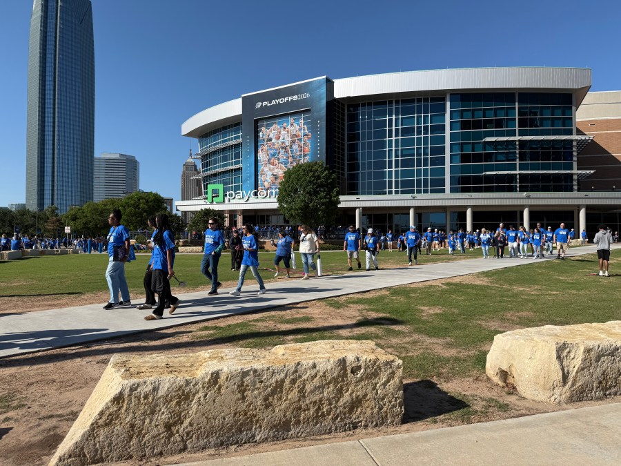 Fans cheer on the Thunder during game one of NBA playoffs