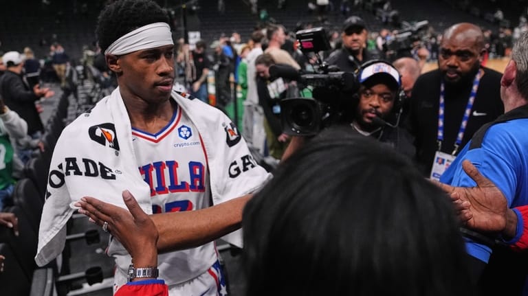 Philadelphia 76ers guard Vj Edgecombe is congratulated by fans after...