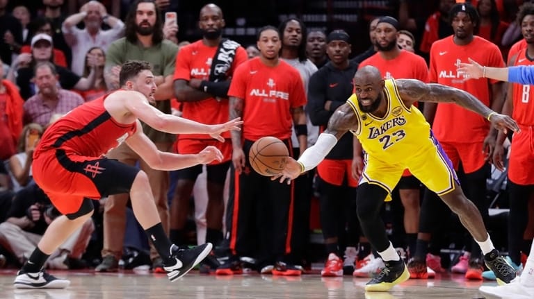 Los Angeles Lakers forward LeBron James (23) tips the ball...