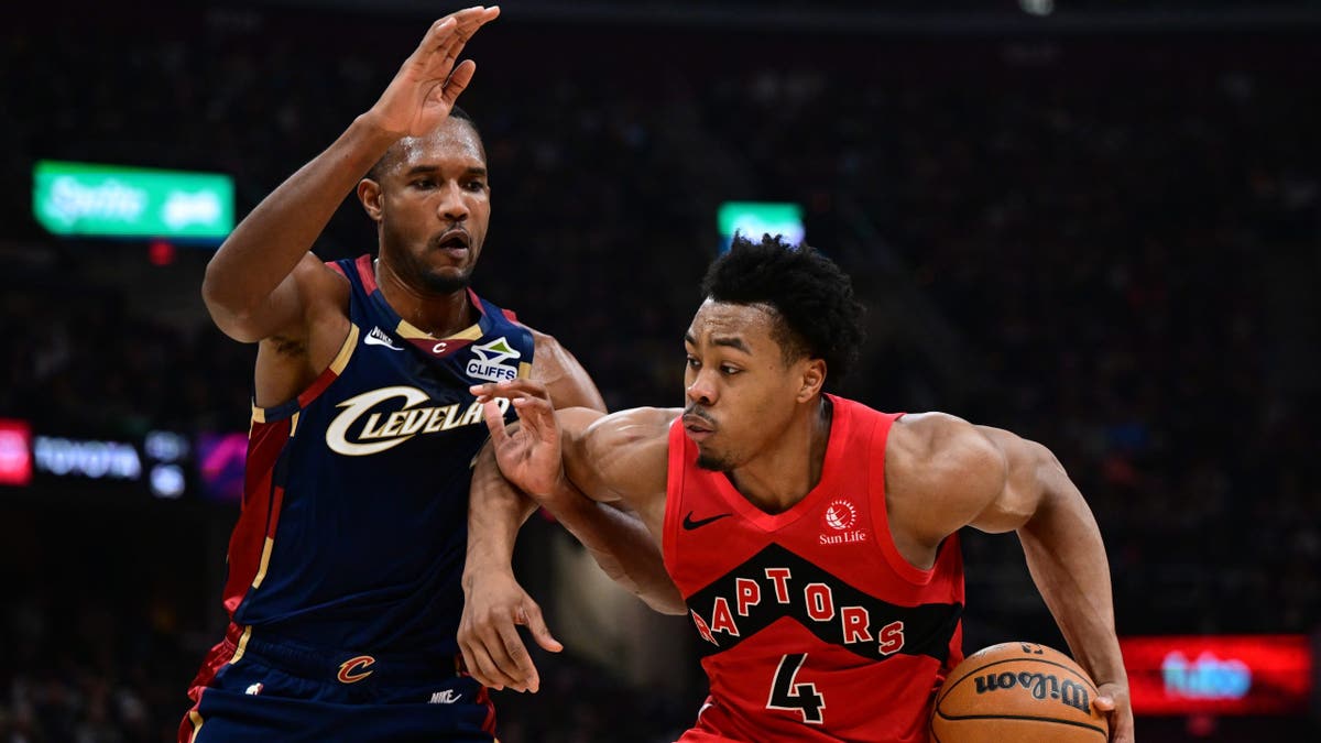 Toronto Raptors forward Scottie Barnes drives on Cleveland Cavaliers big Evan Mobley during the first round of the 2026 NBA Playoffs at Rocket Arena.