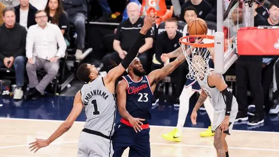 Isaiah Jackson #23 of the LA Clippers lays the ball up past Victor Wembanyama #1 of the San Antonio Spurs during an NBA basketball game, Monday March 16, 2026 in Inglewood, Calif.