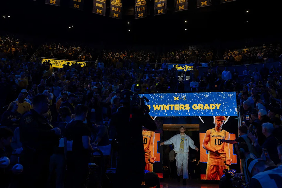 Michigan Wolverines player Winters Grady walks through the tunnel during a national championship celebration at Crisler Center in Ann Arbor on Saturday, April 11, 2026.