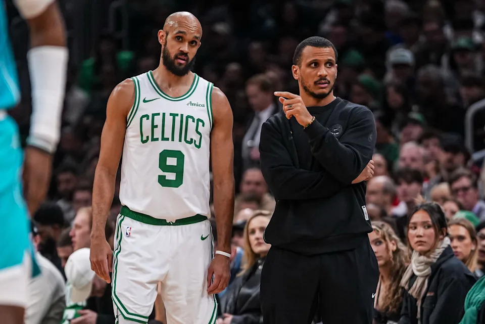 Apr 7, 2026; Boston, Massachusetts, USA; Boston Celtics head coach Joe Mazzulla with guard Derrick White (9) from the sideline as they take on the Charlotte Hornets at TD Garden. Mandatory Credit: David Butler II-Imagn Images