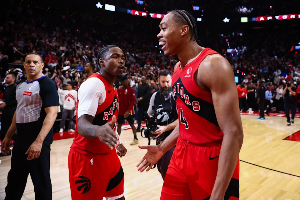 TORONTO, CANADA - APRIL 26: Scottie Barnes #4 and Jamal Shead #23 of the Toronto Raptors celebrate at the end of Game Four of the Eastern Conference First Round NBA Playoffs against the Cleveland Cavaliers at Scotiabank Arena on April 26, 2026 in Toronto, Ontario, Canada. NOTE TO USER: User expressly acknowledges and agrees that, by downloading and or using this photograph, User is consenting to the terms and conditions of the Getty Images License Agreement. (Photo by Cole Burston/Getty Images)