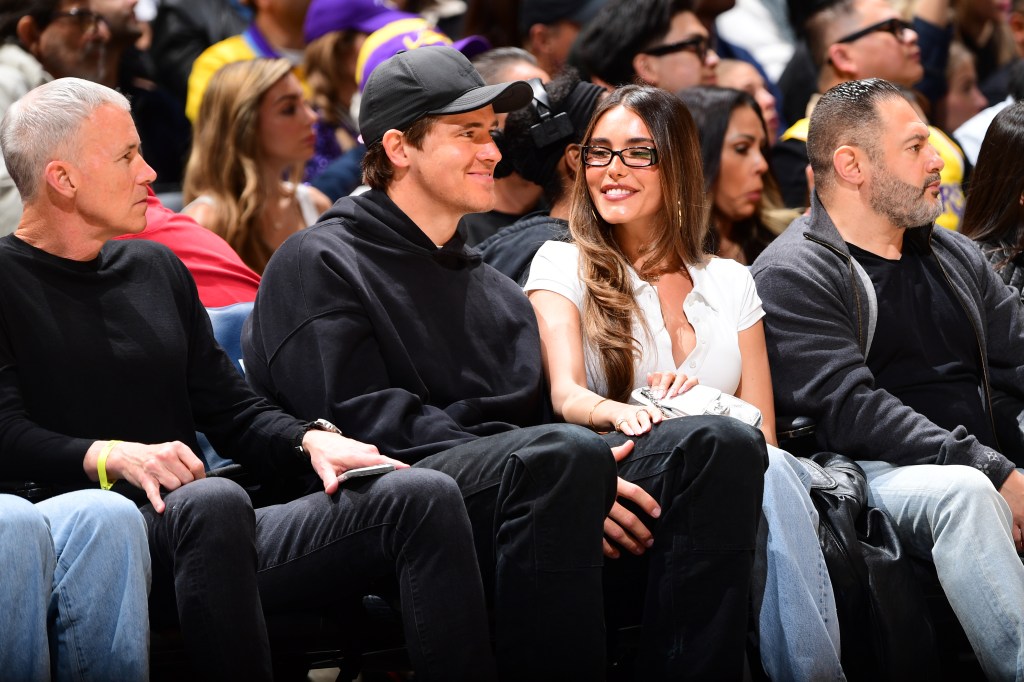 Justin Herbert and Madison Beer attending a game between the Cleveland Cavaliers and the Los Angeles Lakers.