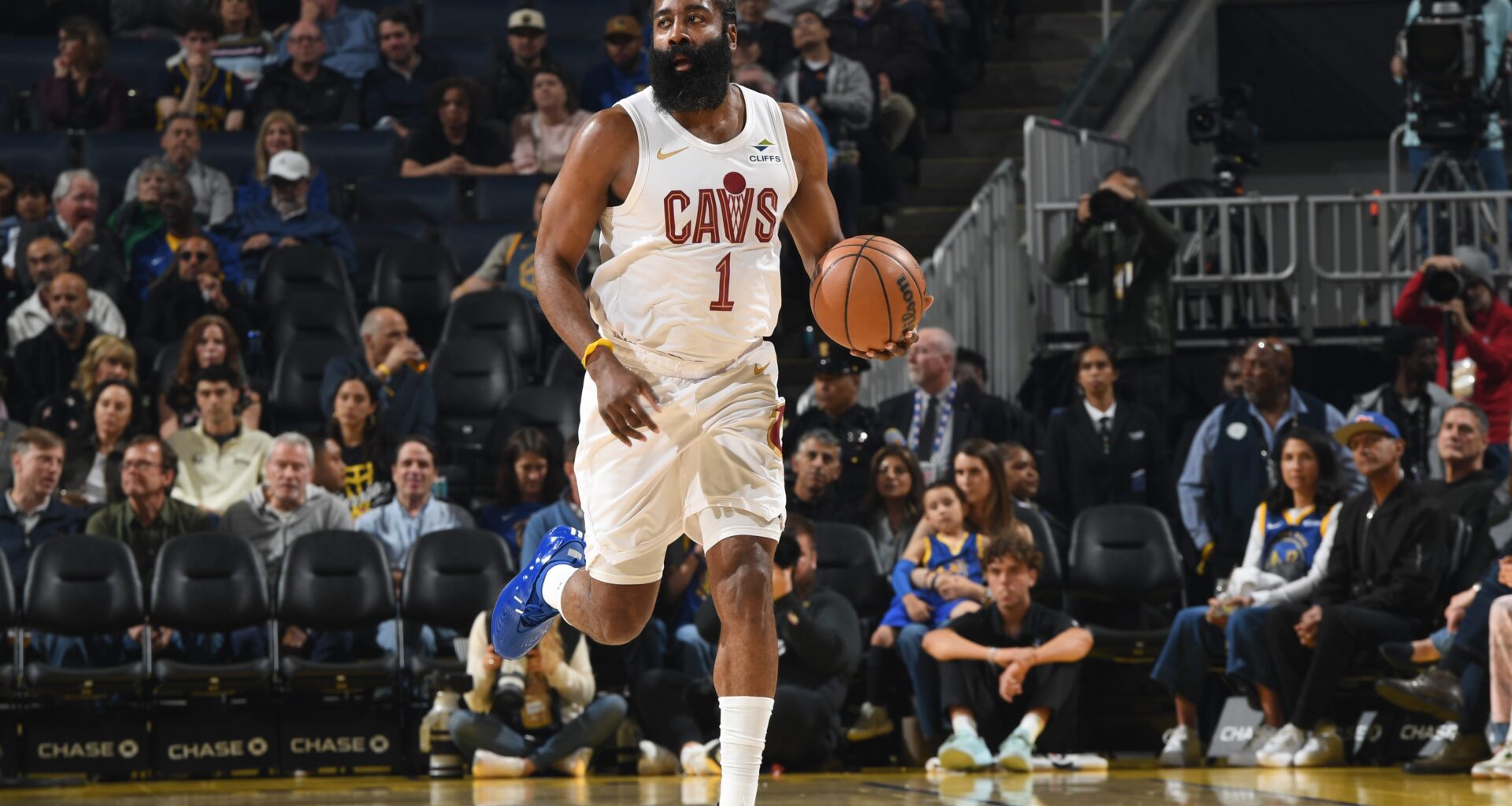 James Harden brings the ball up the court.