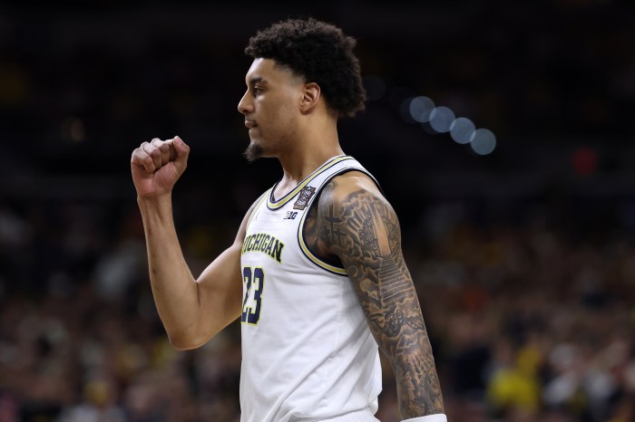 Yaxel Lendeborg pumps his fist in the air.