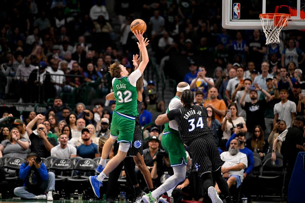 Dallas Mavericks forward Cooper Flagg (32) makes a jump shot over Orlando Magic forward Jamal Cain (8) for his fiftieth point of the night during the fourth quarter at the American Airlines Center. Jerome Miron-Imagn Images
