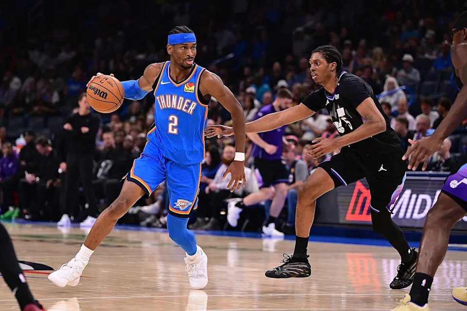 OKLAHOMA CITY, OKLAHOMA - APRIL 5: Shai Gilgeous-Alexander #2 of the Oklahoma City Thunder handles the ball against Cody Williams #5 of the Utah Jazz during the second half at Paycom Center on April 5, 2026 in Oklahoma City, Oklahoma. NOTE TO USER: User expressly acknowledges and agrees that, by downloading and or using this photograph, User is consenting to the terms and conditions of the Getty Images License Agreement. (Photo by Joshua Gateley/Getty Images)