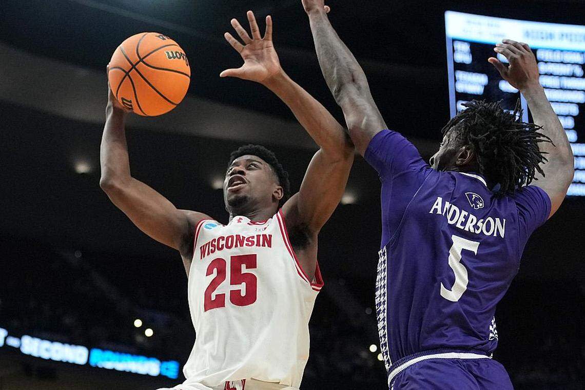 PORTLAND, OREGON - MARCH 19: John Blackwell (25) of the Wisconsin Badgers shoots against Terry Anderson (5) of the High Point Panthers during the second half in the first round of the 2026 NCAA Men's Basketball Tournament at Moda Center on March 19, 2026 in Portland, Oregon. The Panthers won 83-82 in regulation.