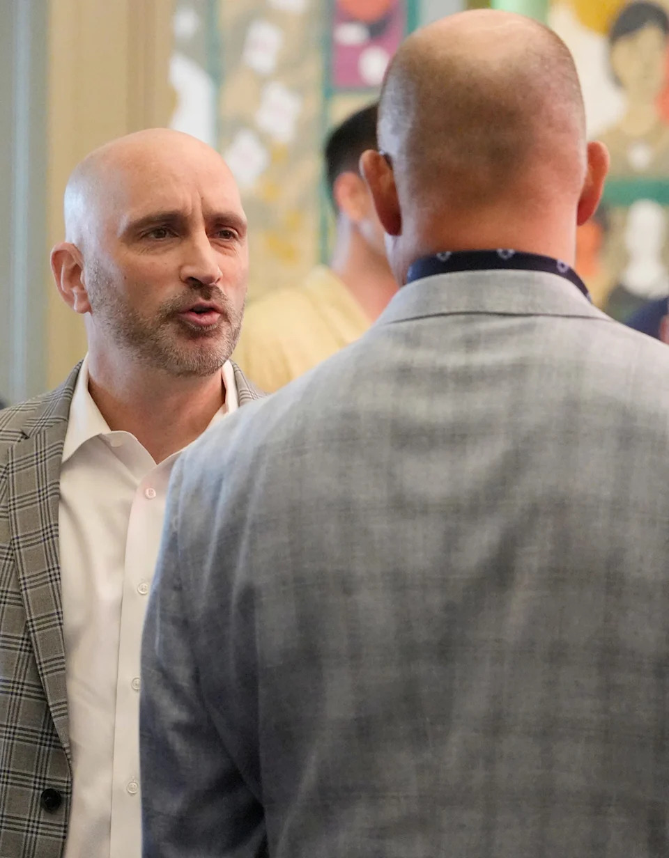 University of Akron men's basketball coach Dustin Ford talks to Bud Wentz before the event to introduce coach Ford at House Three Thirty in Akron on April 15, 2026.