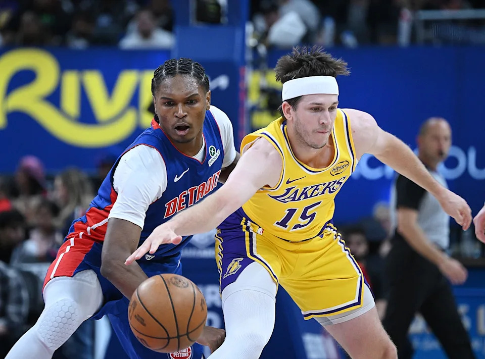 Detroit Pistons guard/forward Ausar Thompson (9) knocks the ball from Los Angeles Lakers guard Austin Reaves (15) in the first half. Detroit Pistons vs Los Angeles Lakers, at Little Caesars Arena on Monday, March 23, 2026, in Detroit, Mich.