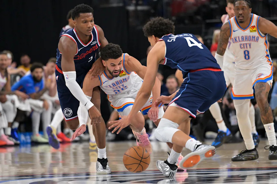 Apr 8, 2026; Inglewood, California, USA; Los Angeles Clippers forward Kawhi Leonard (2), guard Kobe Sanders (4) and Oklahoma City Thunder guard Ajay Mitchell (25) battle for a loose ball in the second half at Intuit Dome. Mandatory Credit: Jayne Kamin-Oncea-Imagn Images