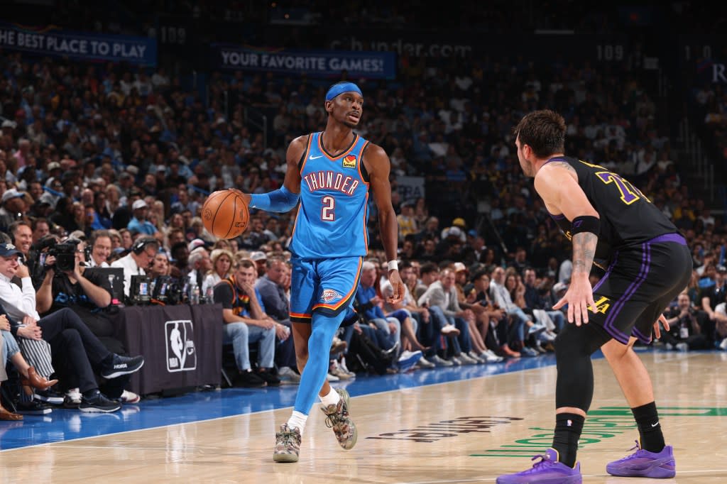 Shai Gilgeous-Alexander brings the ball up court against the Lakers. NBAE via Getty Images