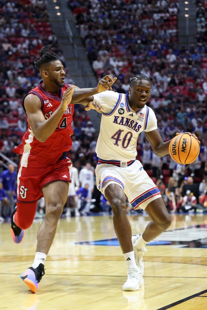 Flory Bidunga drives on Zuby Ejiofor during Kansas’ second-round loss to St. John’s in the NCAA Tournament. Getty Images