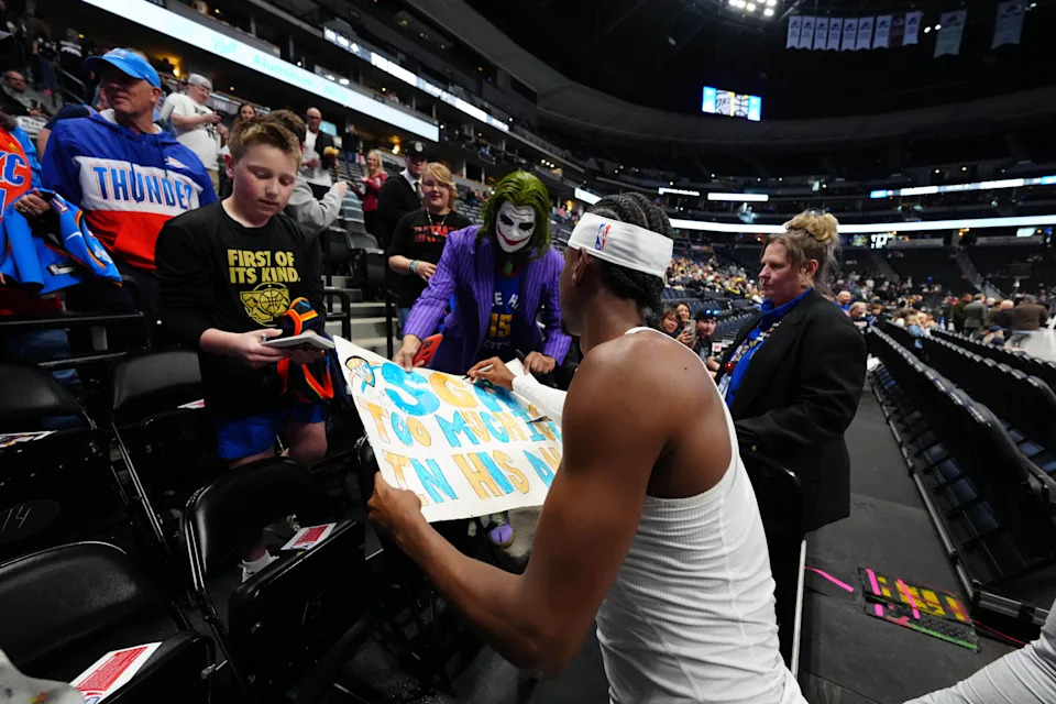 Apr 10, 2026; Denver, Colorado, USA; Oklahoma City Thunder guard Shai Gilgeous-Alexander (2) signs autographs before the game against the Denver Nuggets at Ball Arena. Mandatory Credit: Ron Chenoy-Imagn Images