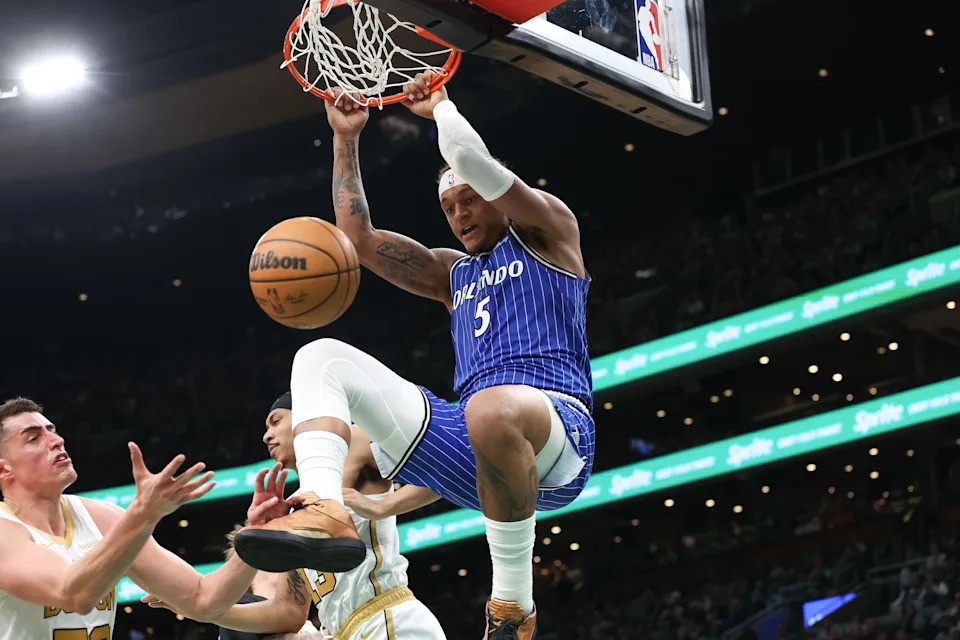 Apr 12, 2026; Boston, Massachusetts, USA; Orlando Magic forward Paolo Banchero (5) dunks the ball during the first half against the Boston Celtics at TD Garden. Mandatory Credit: Paul Rutherford-Imagn Images