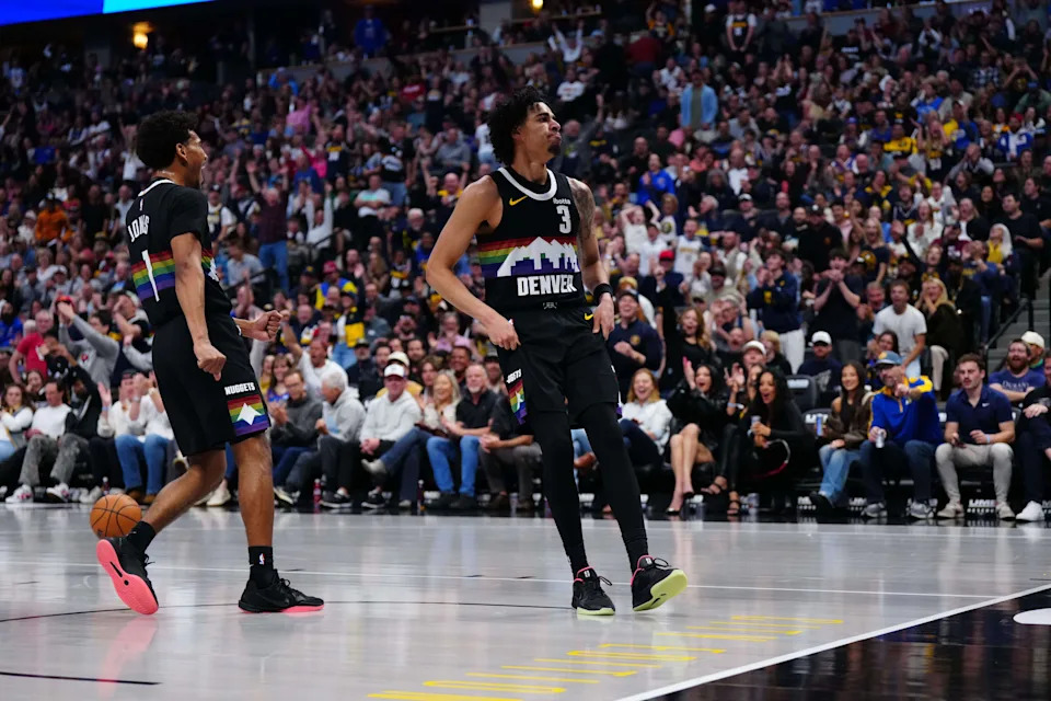 Apr 10, 2026; Denver, Colorado, USA; Denver Nuggets guard Julian Strawther (3) and guard Curtis Jones (1) react to a score in the second half against the Oklahoma City Thunder at Ball Arena. Mandatory Credit: Ron Chenoy-Imagn Images