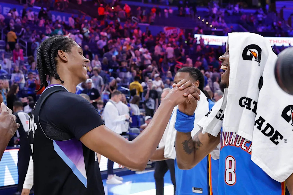 Apr 5, 2026; Oklahoma City, Oklahoma, USA; Utah Jazz forward Cody Williams (5) meets up with his brother Oklahoma City Thunder guard Jalen Williams (8) after their game at Paycom Center. Mandatory Credit: Alonzo Adams-Imagn Images